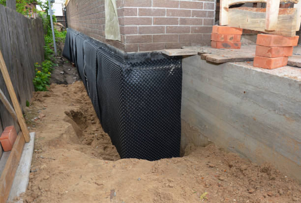 SJ Waterproofing Pros technician performing targeted Waterproofing assessment in Feasterville Trevose, PA